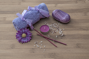 purple towels on wooden background